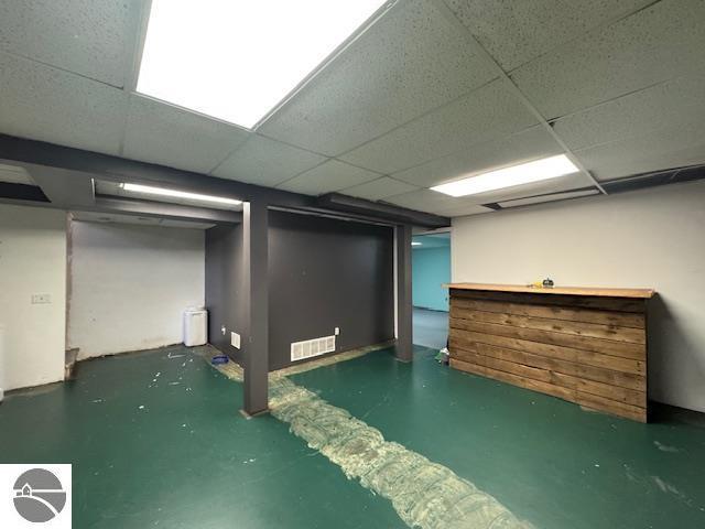 2195 S Sara Dr, Lake City, MI 49651 - finished basement with a paneled ceiling