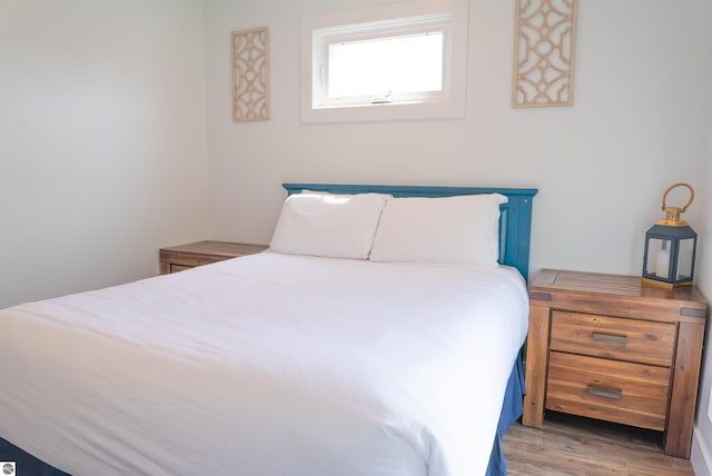 bedroom with light wood-type flooring