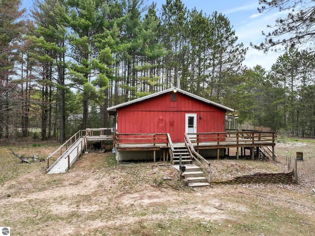 view of outdoor structure featuring a wooded view