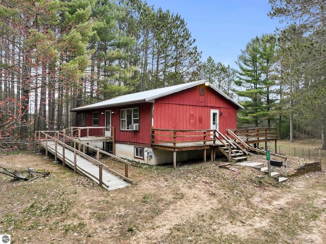 view of side of home with a deck