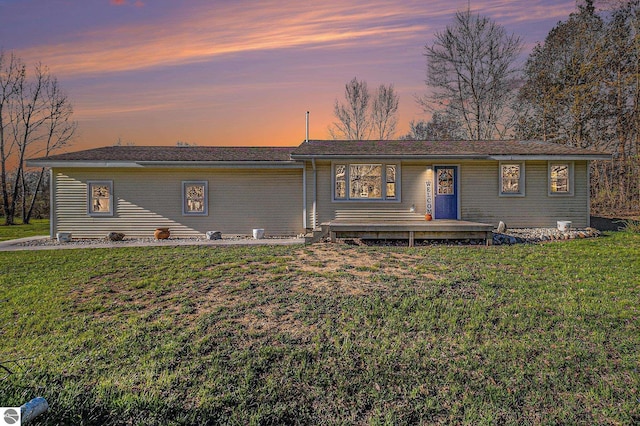 4507 Maidens Rd, Onekama, MI 49675 - back of property at dusk with a yard