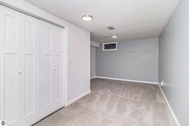 4507 Maidens Rd, Onekama, MI 49675 - unfurnished bedroom with carpet floors, baseboards, and a closet