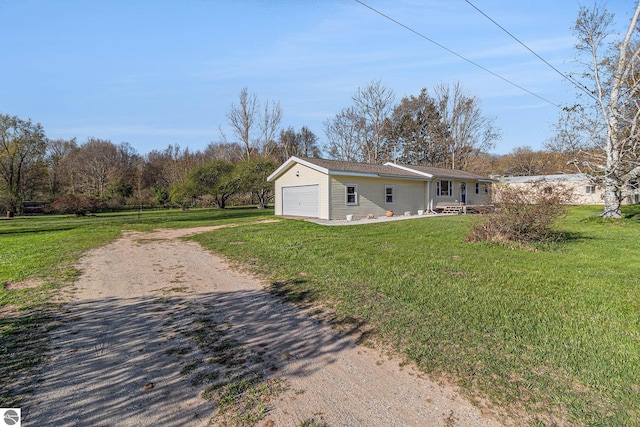 4507 Maidens Rd, Onekama, MI 49675 - view of front facade with driveway, a front lawn, and an attached garage