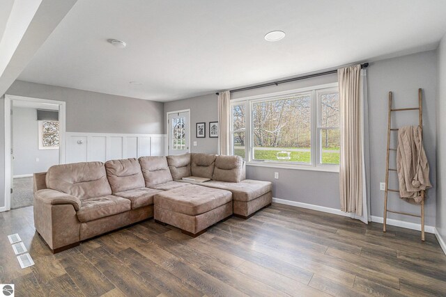 4507 Maidens Rd, Onekama, MI 49675 - living room featuring dark wood-style floors and baseboards