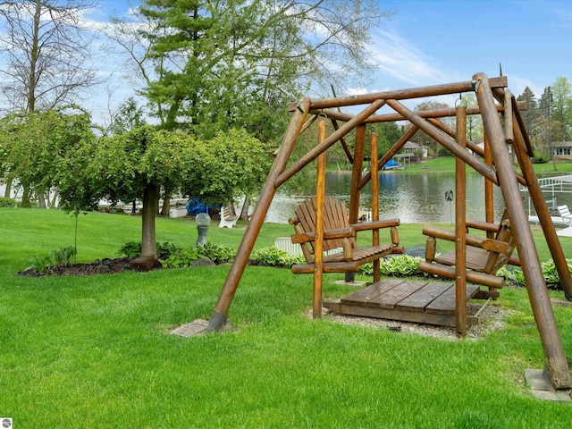 9311 Whipple Shores Dr, Clarkston, MI 48348 - view of playground featuring a yard and a water view