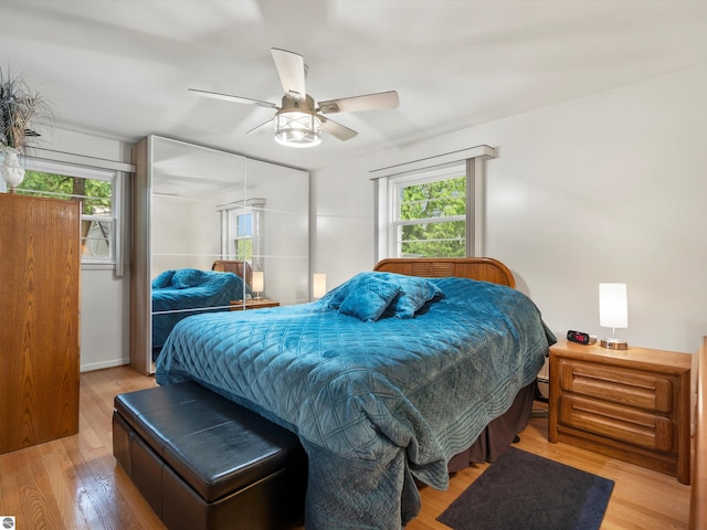 9311 Whipple Shores Dr, Clarkston, MI 48348 - bedroom with wood finished floors and a ceiling fan