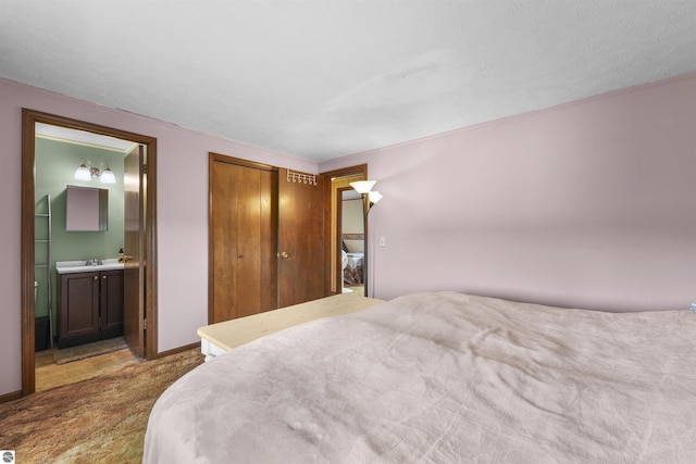 3610 S Call Rd, Lake City, MI 49651 - carpeted bedroom with a closet, ensuite bathroom, and baseboards