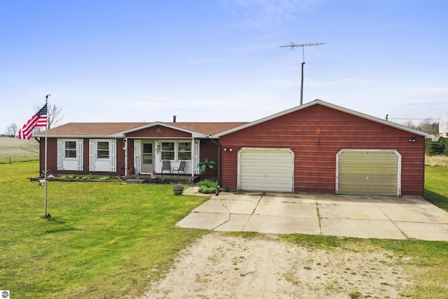 3610 S Call Rd, Lake City, MI 49651 - view of front facade featuring driveway, a front lawn, a garage, and a porch