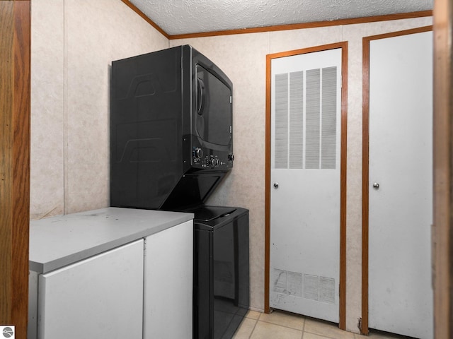 12036 SW Spring Creek Rd, Fife Lake, MI 49633 - laundry area featuring stacked washer and clothes dryer, a heating unit, crown molding, light tile patterned floors, and a textured ceiling
