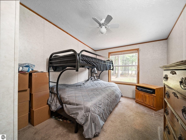 12036 SW Spring Creek Rd, Fife Lake, MI 49633 - bedroom with carpet, ornamental molding, a textured ceiling, and ceiling fan