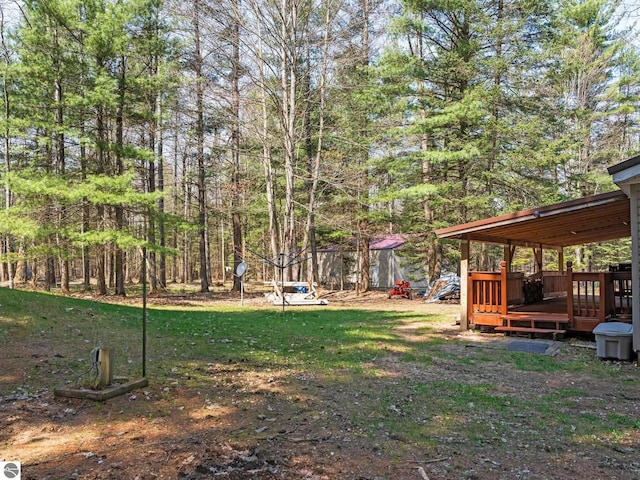 12036 SW Spring Creek Rd, Fife Lake, MI 49633 - view of yard featuring a wooden deck
