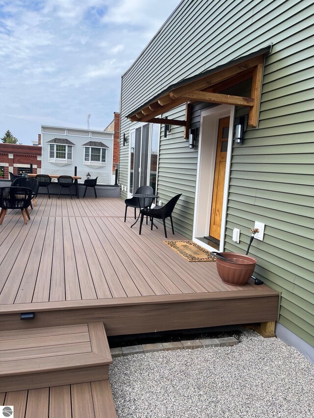 127 River St, Elk Rapids, MI 49629 - wooden deck with an outdoor living space