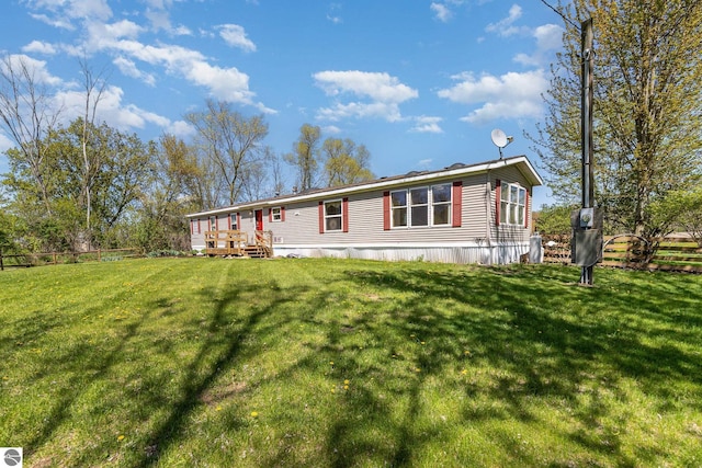10946 N Rich Rd, Alma, MI 48801 - manufactured / mobile home with a wooden deck