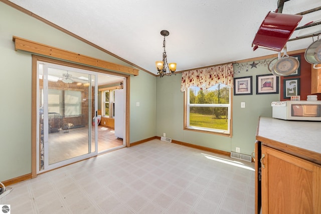 10946 N Rich Rd, Alma, MI 48801 - unfurnished dining area featuring light floors, a chandelier, crown molding, baseboards, and vaulted ceiling