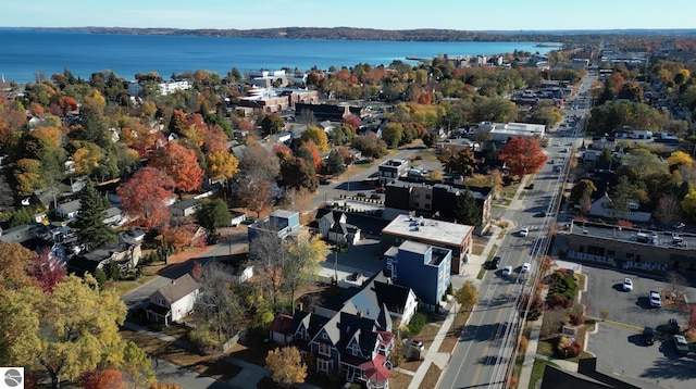 aerial view of property and surrounding area with a large body of water
