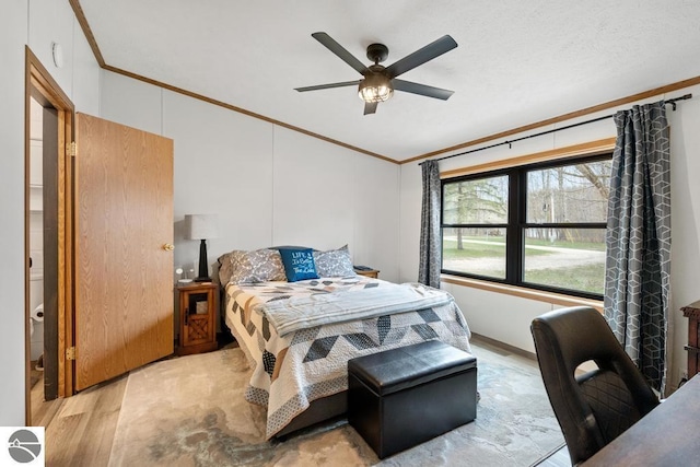 11420 Muskie Way, Ellsworth, MI 49729 - bedroom with crown molding, wood finished floors, and ceiling fan