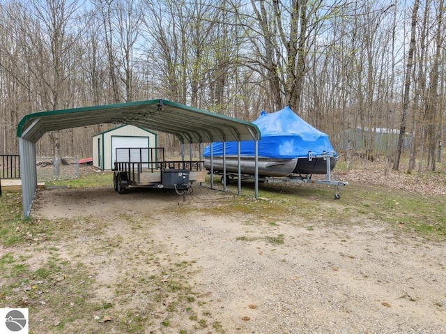 11420 Muskie Way, Ellsworth, MI 49729 - view of car parking with a carport and a storage unit
