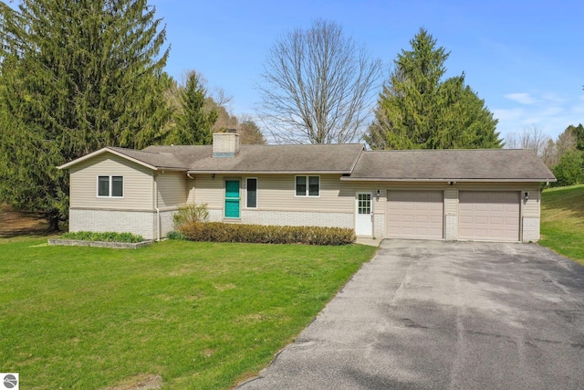 11531 S Tower Rd, Maple City, MI 49664 - ranch-style home with a garage, driveway, a chimney, brick siding, and a front lawn