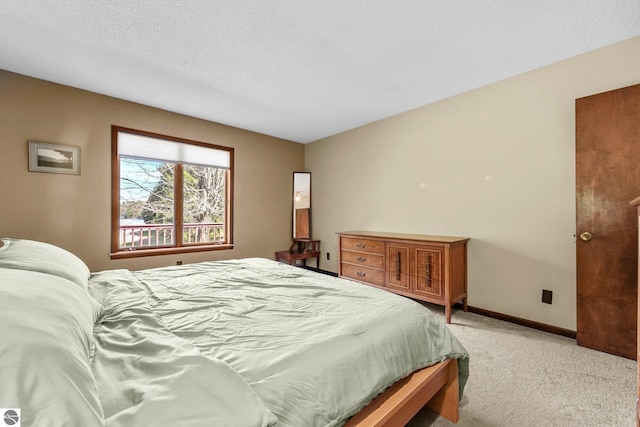 11531 S Tower Rd, Maple City, MI 49664 - bedroom with light colored carpet and baseboards