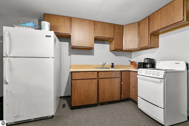11531 S Tower Rd, Maple City, MI 49664 - kitchen featuring white appliances, a sink, light countertops, and brown cabinets