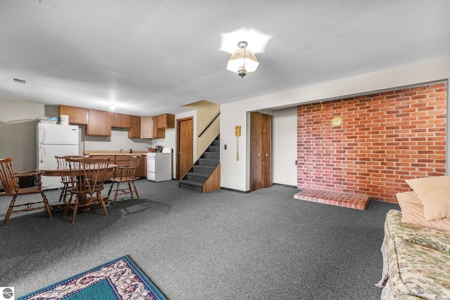 11531 S Tower Rd, Maple City, MI 49664 - living area with carpet, stairs, bar, and brick wall