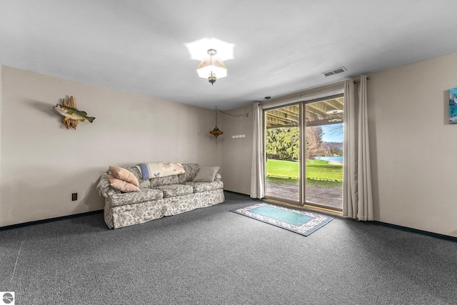 11531 S Tower Rd, Maple City, MI 49664 - living room featuring carpet floors and baseboards