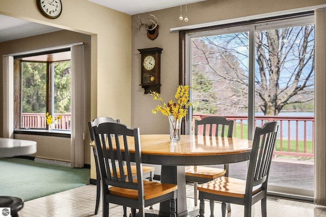 11531 S Tower Rd, Maple City, MI 49664 - dining area with healthy amount of natural light and light carpet
