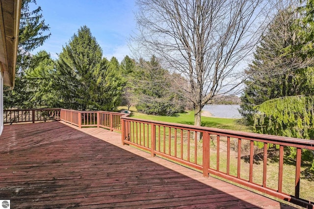11531 S Tower Rd, Maple City, MI 49664 - wooden deck featuring a water view