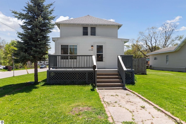 1040 Eastward St, Alma, MI 48801 - american foursquare style home with a wooden deck and a front yard