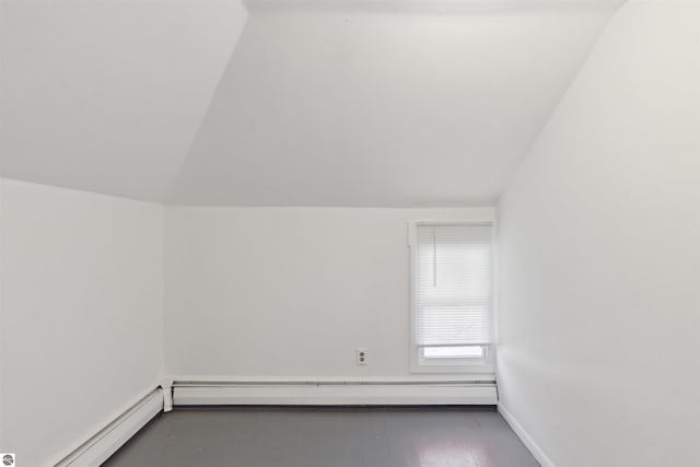1040 Eastward St, Alma, MI 48801 - bonus room featuring vaulted ceiling and a baseboard heating unit