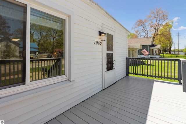1040 Eastward St, Alma, MI 48801 - wooden deck with a lawn
