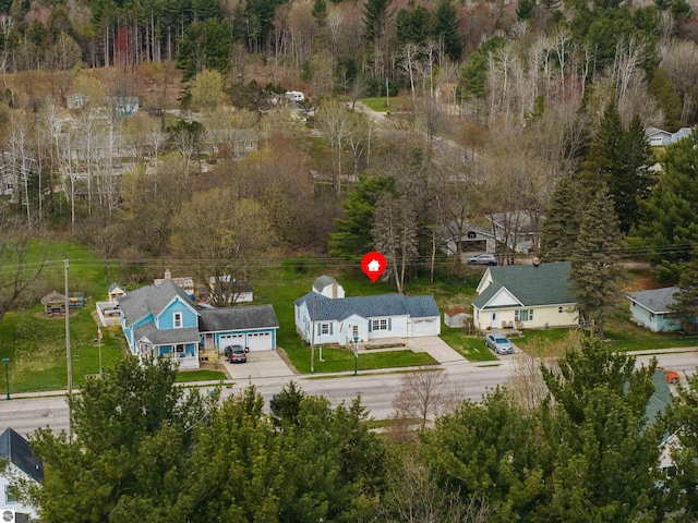 view from above of property featuring a forest