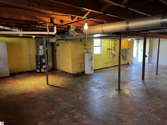 basement featuring electric water heater and heating unit