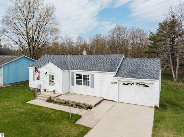 view of front facade with a shingled roof, a chimney, an attached garage, and a front yard