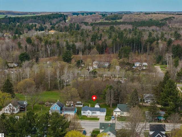 view of property location featuring a heavily wooded area