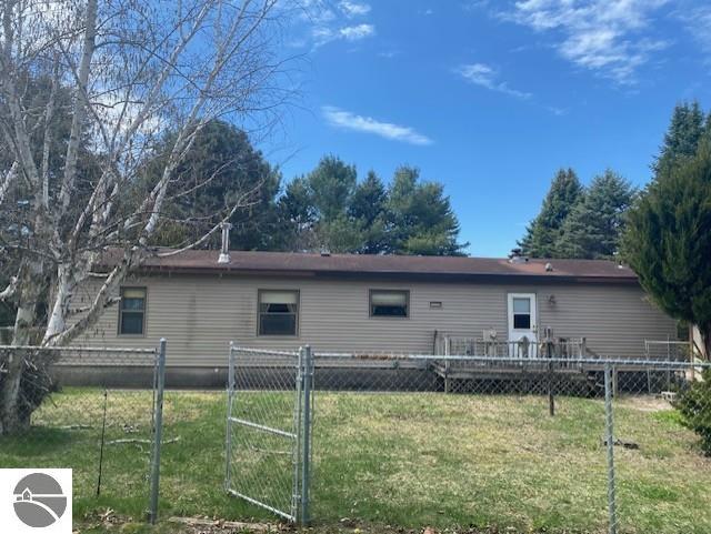 8067 Cherry Ave, Rapid City, MI 49676 - view of rear view of house