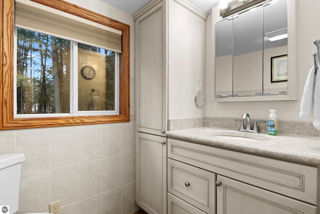 bathroom with toilet and vanity