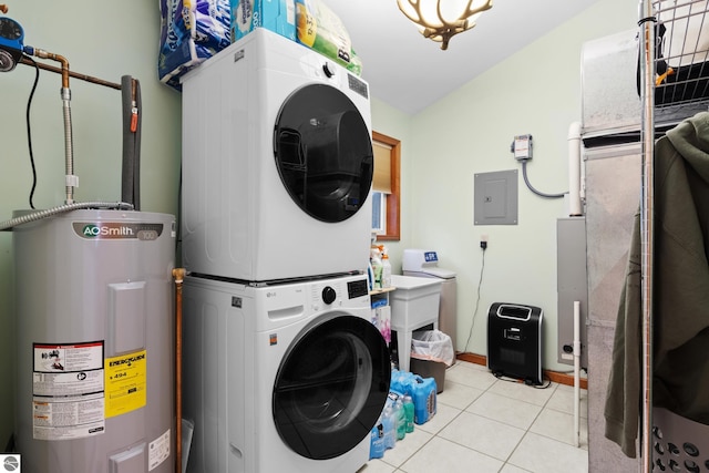 clothes washing area with electric water heater, stacked washer / dryer, electric panel, and tile patterned floors
