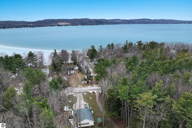 aerial view of property's location with a large body of water