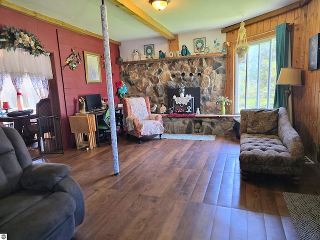 117 S Gladwin St, Lake City, MI 49651 - living area with wood finished floors, beam ceiling, and wood walls
