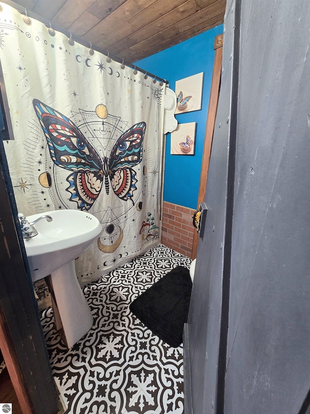 117 S Gladwin St, Lake City, MI 49651 - bathroom featuring wood ceiling and curtained shower