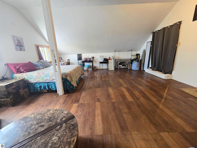 117 S Gladwin St, Lake City, MI 49651 - bedroom with lofted ceiling and wood finished floors
