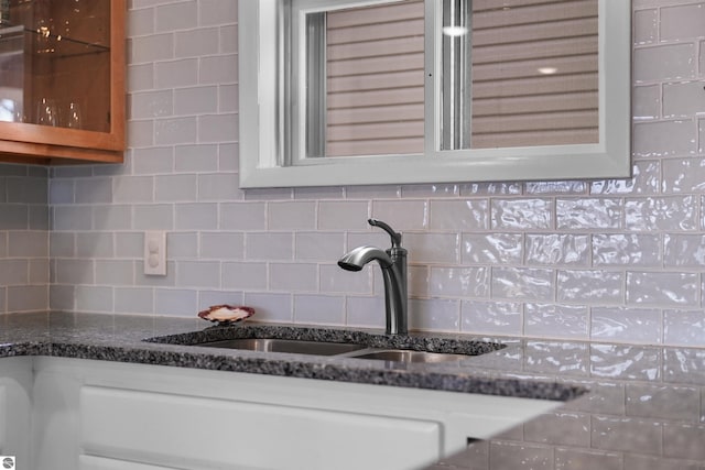 1750 S Schneider St, Lake City, MI 49651 - kitchen view of a sink, backsplash, and dark stone countertops