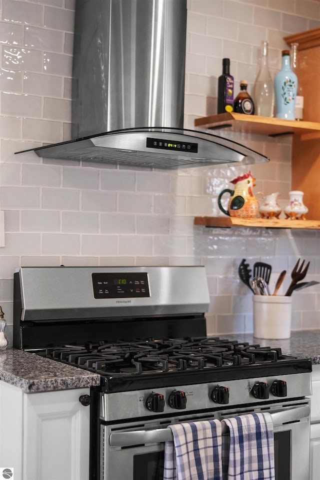 1750 S Schneider St, Lake City, MI 49651 - kitchen featuring gas range, island range hood, and backsplash