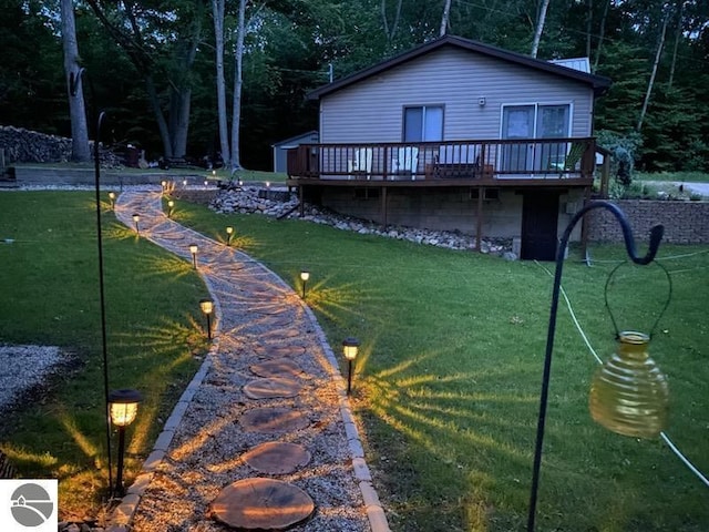 1750 S Schneider St, Lake City, MI 49651 - back of house with a wooden deck and a lawn