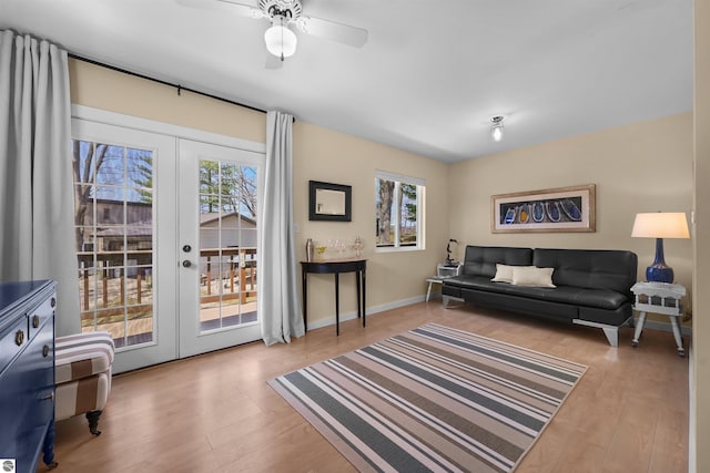 1750 S Schneider St, Lake City, MI 49651 - living area with french doors, wood finished floors, baseboards, and ceiling fan