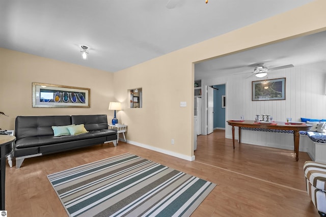 1750 S Schneider St, Lake City, MI 49651 - living area featuring a ceiling fan, wood finished floors, and baseboards