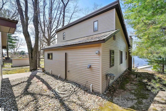 1750 S Schneider St, Lake City, MI 49651 - back of house featuring metal roof and a water view