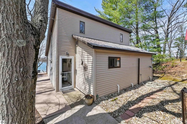 1750 S Schneider St, Lake City, MI 49651 - back of property featuring metal roof