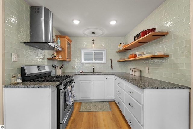 1750 S Schneider St, Lake City, MI 49651 - kitchen with gas range, wall chimney range hood, a sink, light wood-type flooring, and open shelves